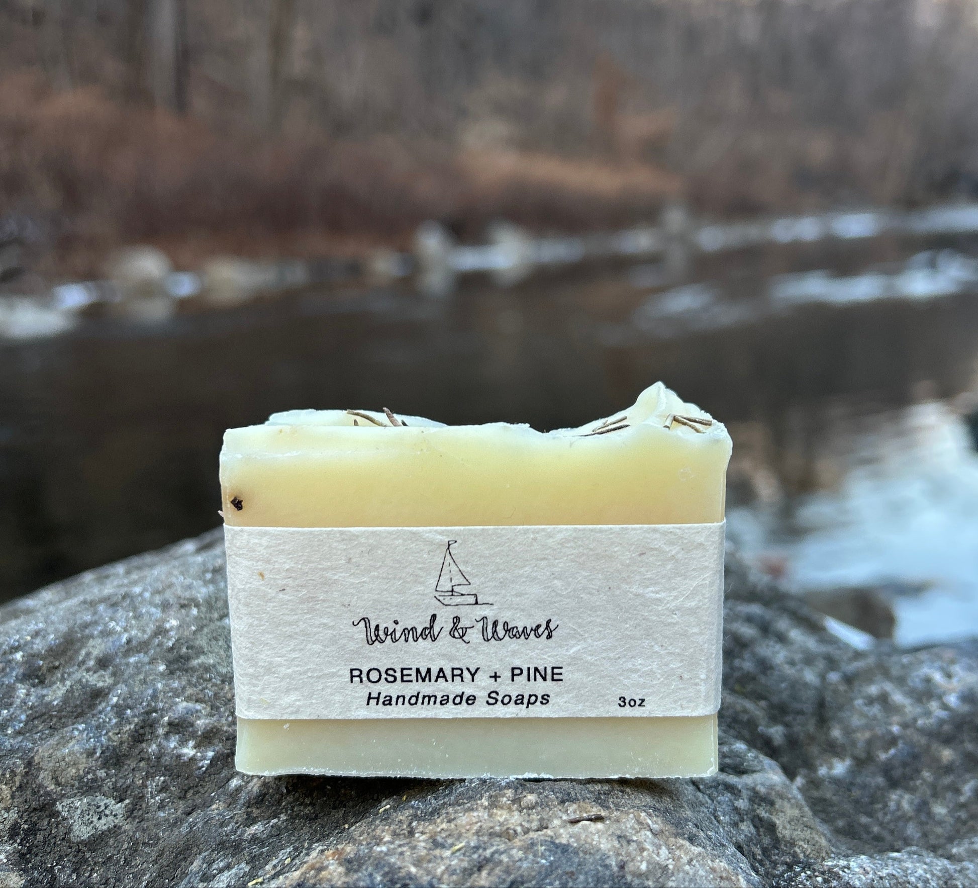 Handmade rosemary and pine soap bar crafted with organic coconut oil, olive oil, shea butter, and mango seed butter for a nourishing cleanse. Scented with rosemary and pine essential oils for a fresh, woodsy aroma. Each bar weighs approximately 3 ounces and is wrapped in eco-friendly lokta paper.