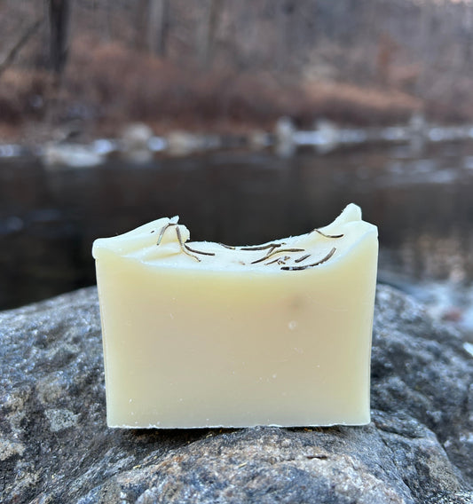 Handmade rosemary and pine soap bar crafted with organic coconut oil, olive oil, shea butter, and mango seed butter for a nourishing cleanse. Scented with rosemary and pine essential oils for a fresh, woodsy aroma. Each bar weighs approximately 3 ounces and is wrapped in eco-friendly lokta paper